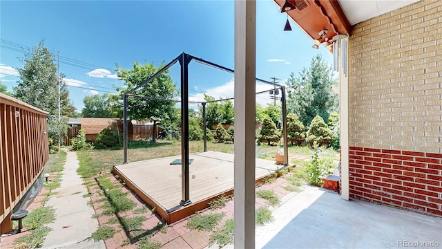 4420 Teller St, Wheat Ridge, CO 80033 - fenced backyard featuring a deck, a patio, and an outdoor structure