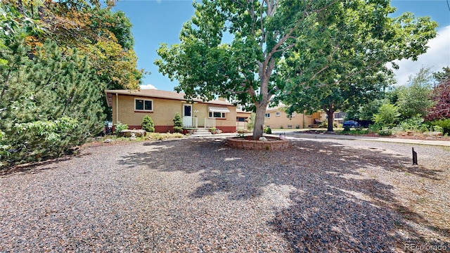 4420 Teller St, Wheat Ridge, CO 80033 - view of front of home featuring brick siding