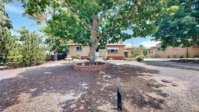 4420 Teller St, Wheat Ridge, CO 80033 - view of front of home featuring a chimney and brick siding