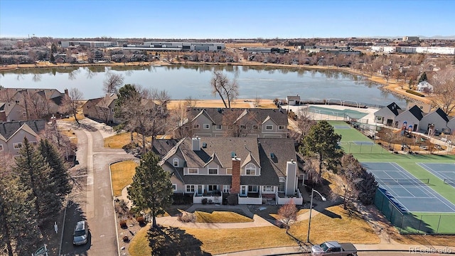 drone / aerial view with a residential view and a water view