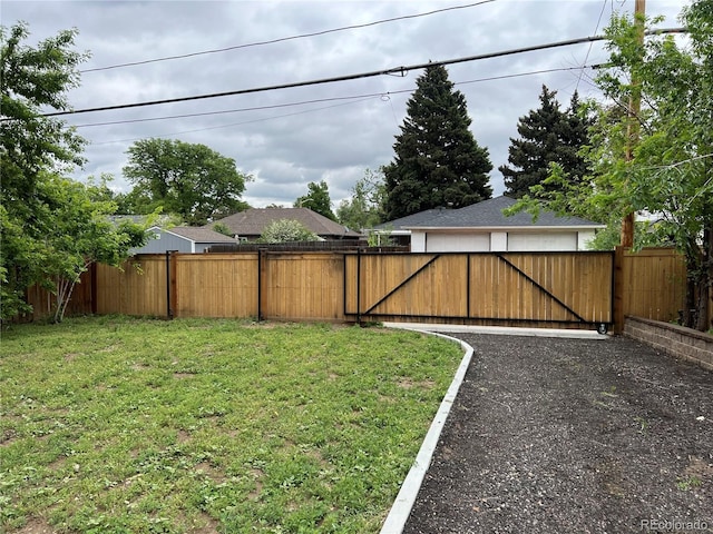 3210 Newport St, Denver, CO 80207 - view of yard featuring a detached garage