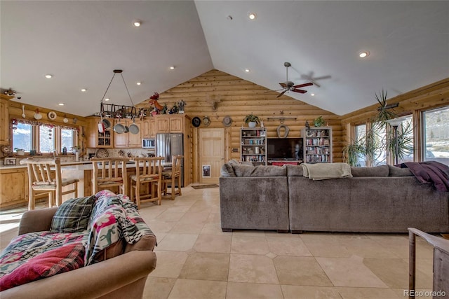 living room with rustic walls, ceiling fan, wooden walls, and lofted ceiling