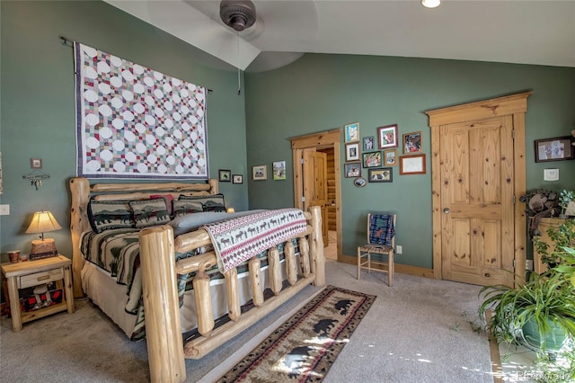 bedroom with ceiling fan, light colored carpet, and lofted ceiling