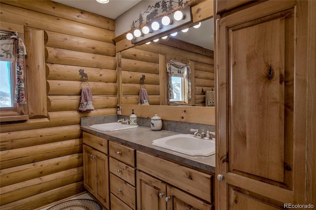 bathroom featuring vanity and log walls