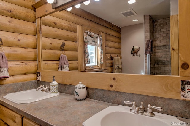 bathroom with log walls and vanity