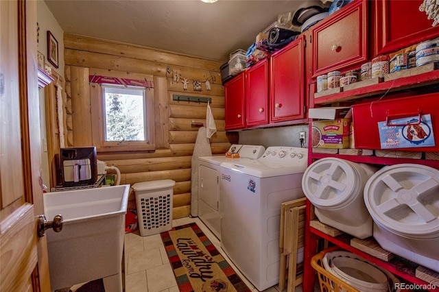 washroom featuring cabinets, log walls, washer and dryer, and light tile patterned floors