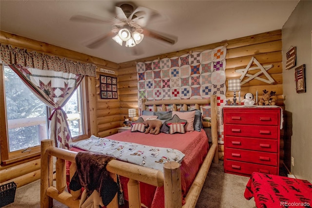 bedroom with ceiling fan and log walls