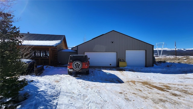 view of snow covered garage