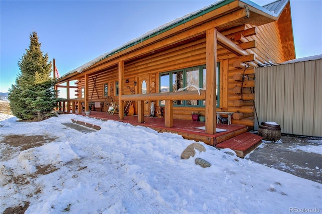 view of snow covered house