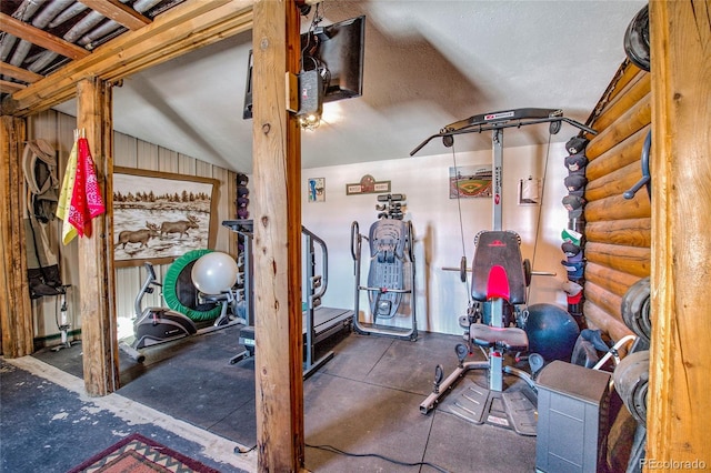 workout room featuring vaulted ceiling