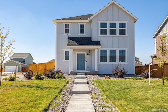 view of front of property featuring board and batten siding, a shingled roof, a front yard, and fence