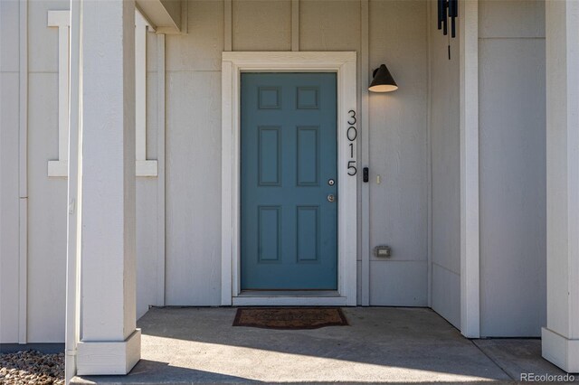 entrance to property featuring board and batten siding