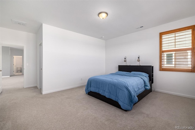 bedroom with visible vents, baseboards, and carpet