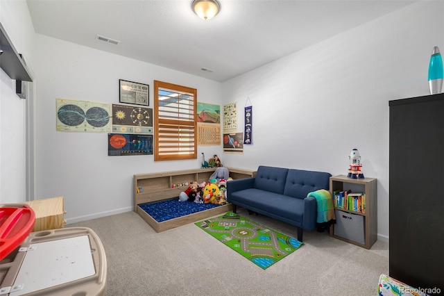 game room with visible vents, baseboards, and carpet flooring