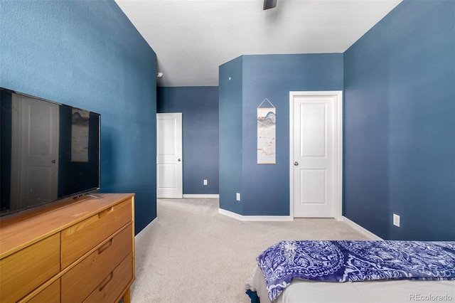 bedroom featuring baseboards, carpet, and ceiling fan