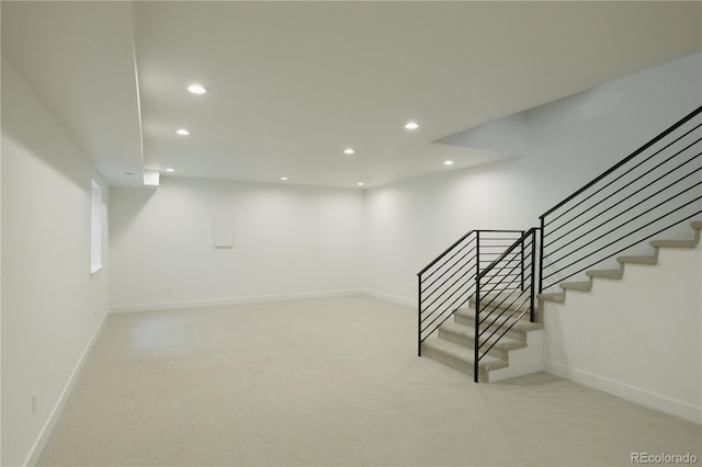 basement with baseboards, stairway, carpet, and recessed lighting