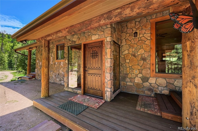 property entrance featuring stone siding