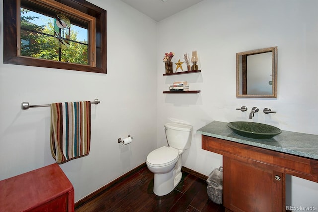 bathroom featuring hardwood / wood-style floors, vanity, and toilet