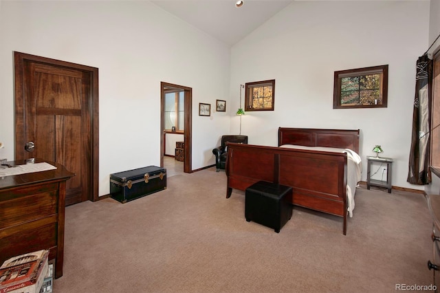 carpeted bedroom featuring high vaulted ceiling