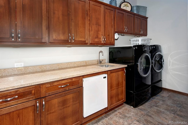 27 Habitat, Dillon, CO 80435 - laundry area with stone finish floors, washing machine and dryer, and cabinet space
