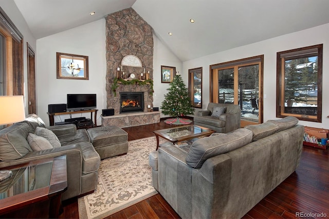 living room featuring a fireplace, high vaulted ceiling, and dark wood-type flooring