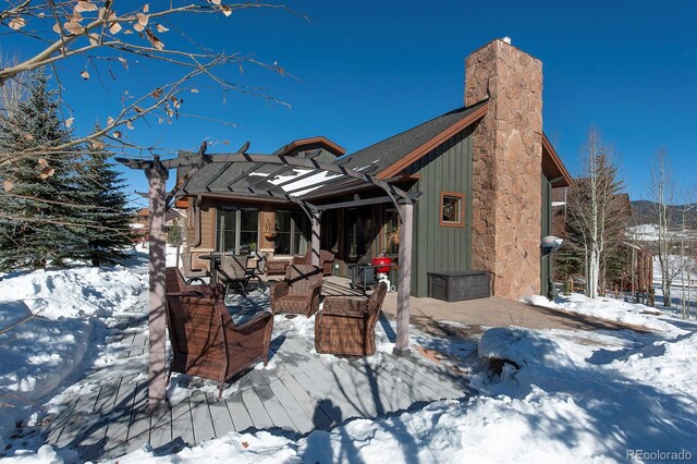 27 Habitat, Dillon, CO 80435 - snow covered property featuring a chimney