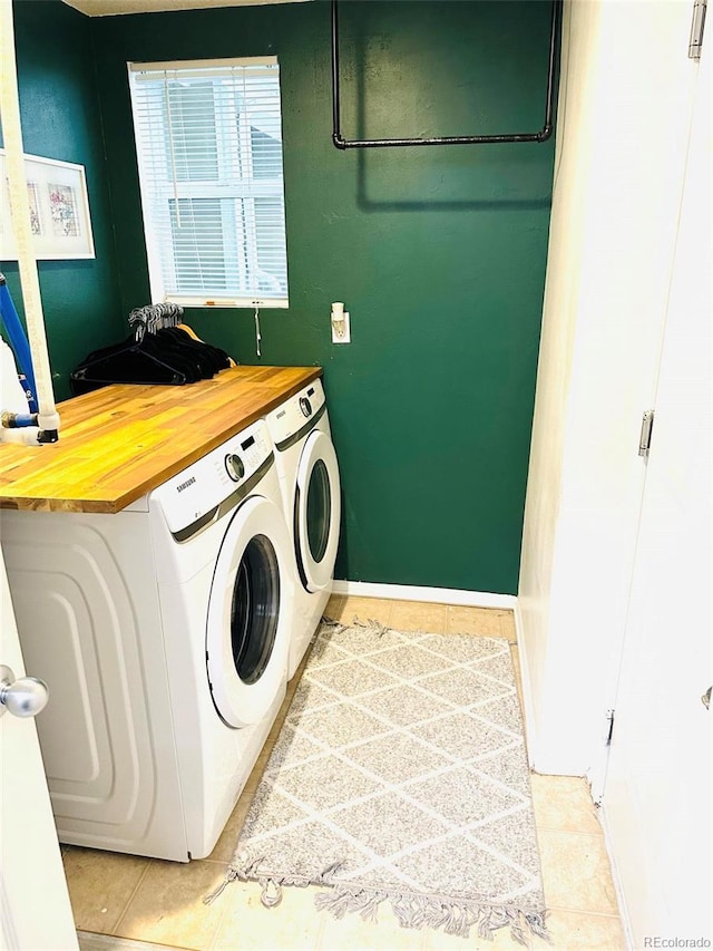 11975 Riverstone Cir Unit 9C, Commerce City, CO 80640 - laundry room featuring washing machine and clothes dryer and light tile patterned flooring