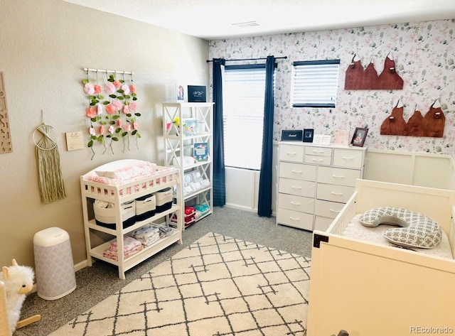 11975 Riverstone Cir Unit 9C, Commerce City, CO 80640 - bedroom with light carpet and wallpapered walls