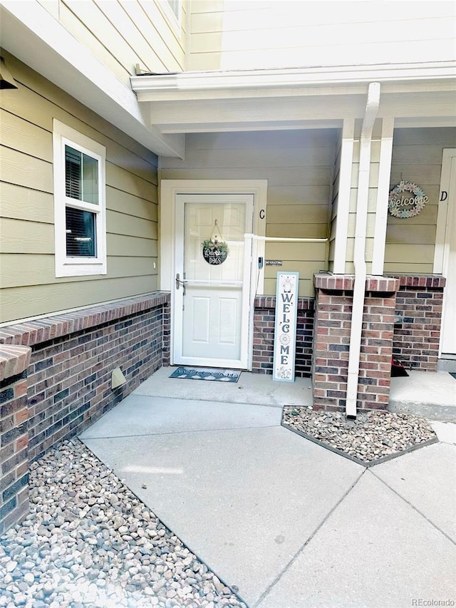 11975 Riverstone Cir Unit 9C, Commerce City, CO 80640 - property entrance featuring a porch