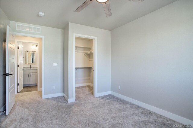 1732 Stable View Dr, Castle Pines, CO 80108 - unfurnished bedroom featuring light carpet, baseboards, a spacious closet, and a closet