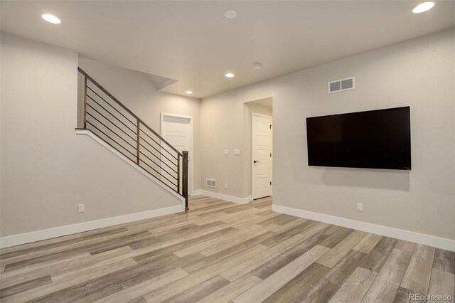 1732 Stable View Dr, Castle Pines, CO 80108 - unfurnished living room featuring stairs, light wood finished floors, recessed lighting, and baseboards
