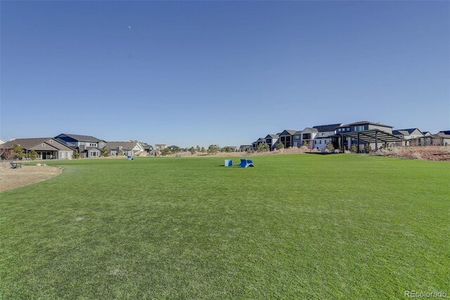 1732 Stable View Dr, Castle Pines, CO 80108 - view of grassy yard featuring a residential view