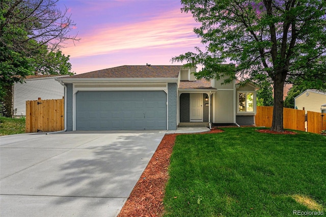11510 Otis St, Westminster, CO 80020 - view of front of property featuring driveway, an attached garage, brick siding, and roof with shingles