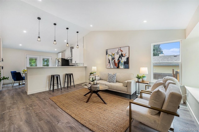 11510 Otis St, Westminster, CO 80020 - living area with vaulted ceiling, dark wood-style flooring, and recessed lighting