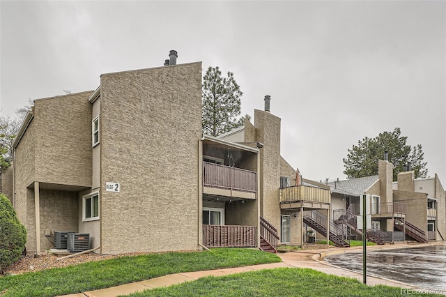 5300 E Cherry Creek S Drive 217, Denver, CO 80246 - view of building exterior featuring stairway and central air condition unit