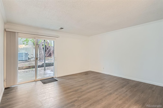 5300 E Cherry Creek S Drive 217, Denver, CO 80246 - unfurnished room with a textured ceiling, wood finished floors, ornamental molding, and baseboards