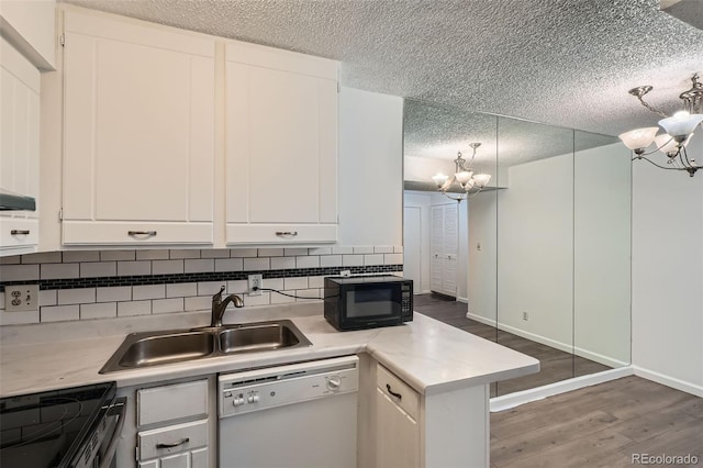 5300 E Cherry Creek S Drive 217, Denver, CO 80246 - kitchen with dishwasher, a chandelier, black microwave, a sink, and a textured ceiling