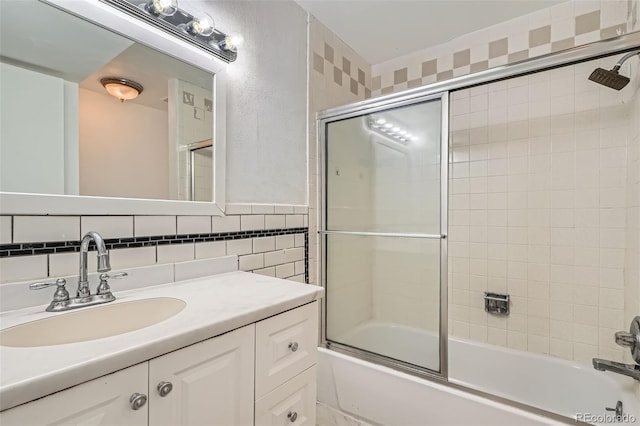 5300 E Cherry Creek S Drive 217, Denver, CO 80246 - bathroom with shower / bath combination with glass door, vanity, and tile walls