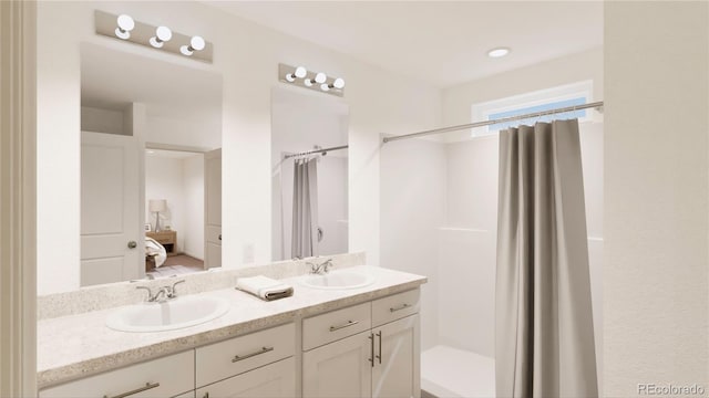 bathroom featuring a shower with shower curtain and vanity