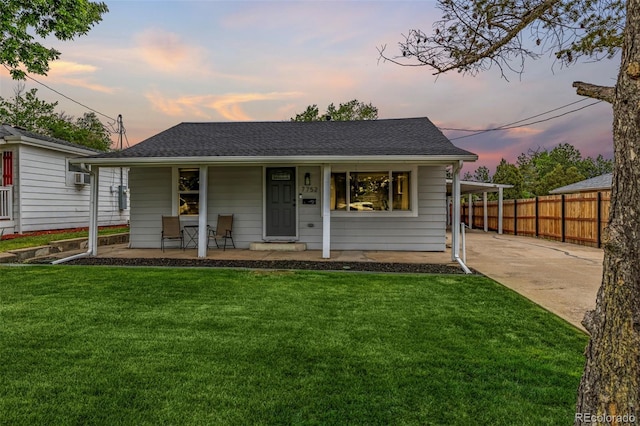 7752 Meade St, Westminster, CO 80030 - view of front facade with covered porch, driveway, a shingled roof, and cooling unit