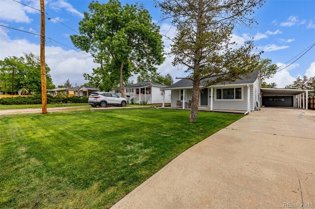 7752 Meade St, Westminster, CO 80030 - single story home with driveway, a front lawn, a carport, and a porch