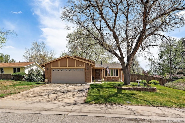 8364 Allison Ct, Arvada, CO 80005 - view of front of house with a garage, concrete driveway, and brick siding