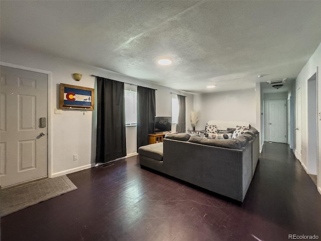 2114 N 21st St, Grand Junction, CO 81501 - living area with a textured ceiling and baseboards