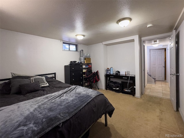 2114 N 21st St, Grand Junction, CO 81501 - bedroom with a textured ceiling and light carpet