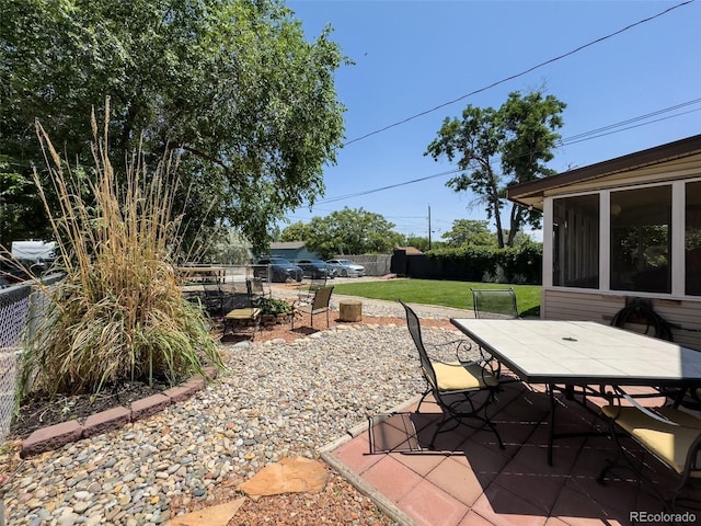 2114 N 21st St, Grand Junction, CO 81501 - view of patio featuring outdoor dining area and a sunroom