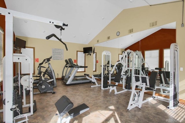 gym featuring high vaulted ceiling