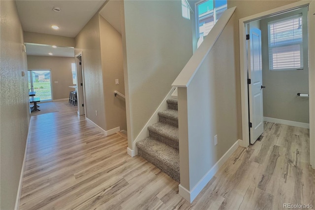 staircase featuring hardwood / wood-style floors