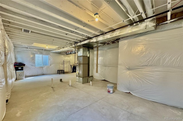 basement featuring heating unit