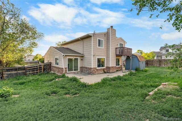 12780 Elm St, Thornton, CO 80241 - rear view of house featuring a chimney, brick siding, and a patio