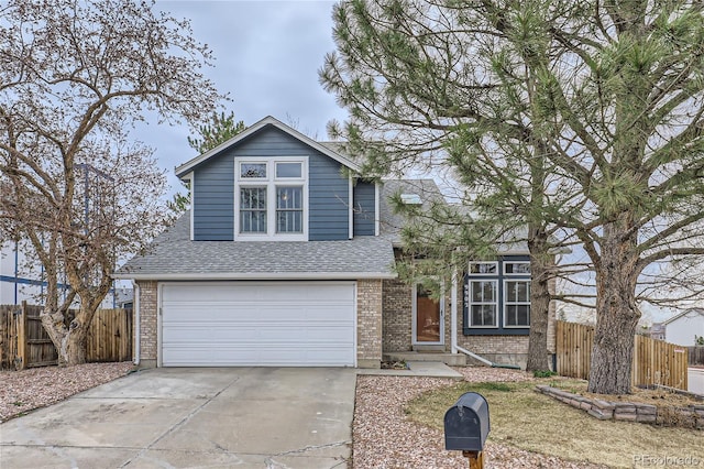 view of front of property with an attached garage, a shingled roof, concrete driveway, and fence